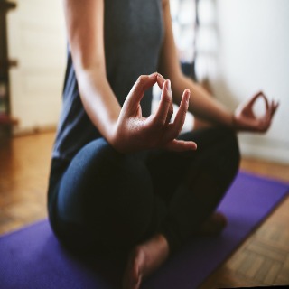 female in a sitting yoga pose